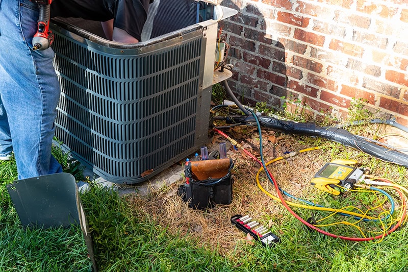 3 Tips to Prevent AC Breakdown During a Heat Wave. Photo of an HVAC Unit installed outside of a home.