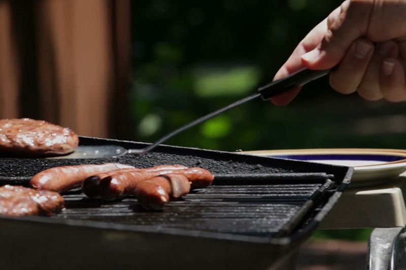 Image of someone using a grill. Video - Energy Saving Tip 1.
