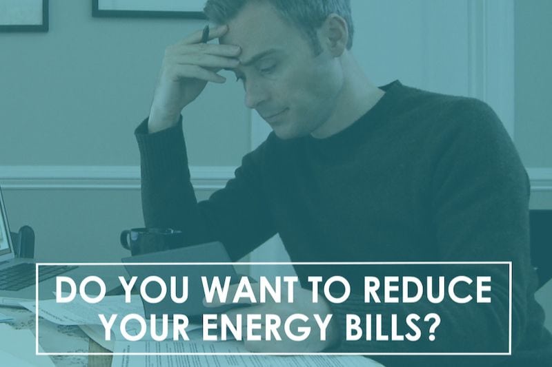 A man studies some papers. Do You Want to Reduce Your Energy Bills?